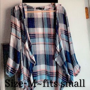 Blue and orange flannel. It’s a medium but it fits small